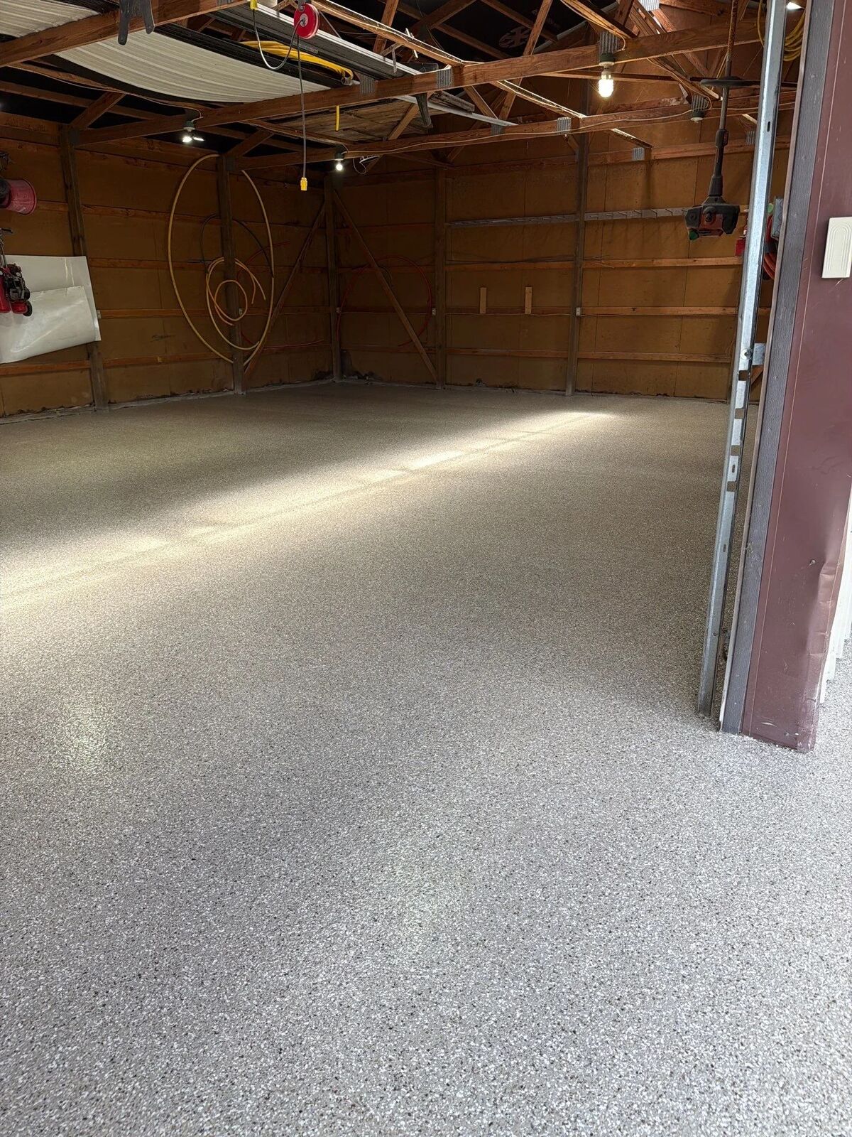 Close view of a finished vinyl flake floor under a clear top coat