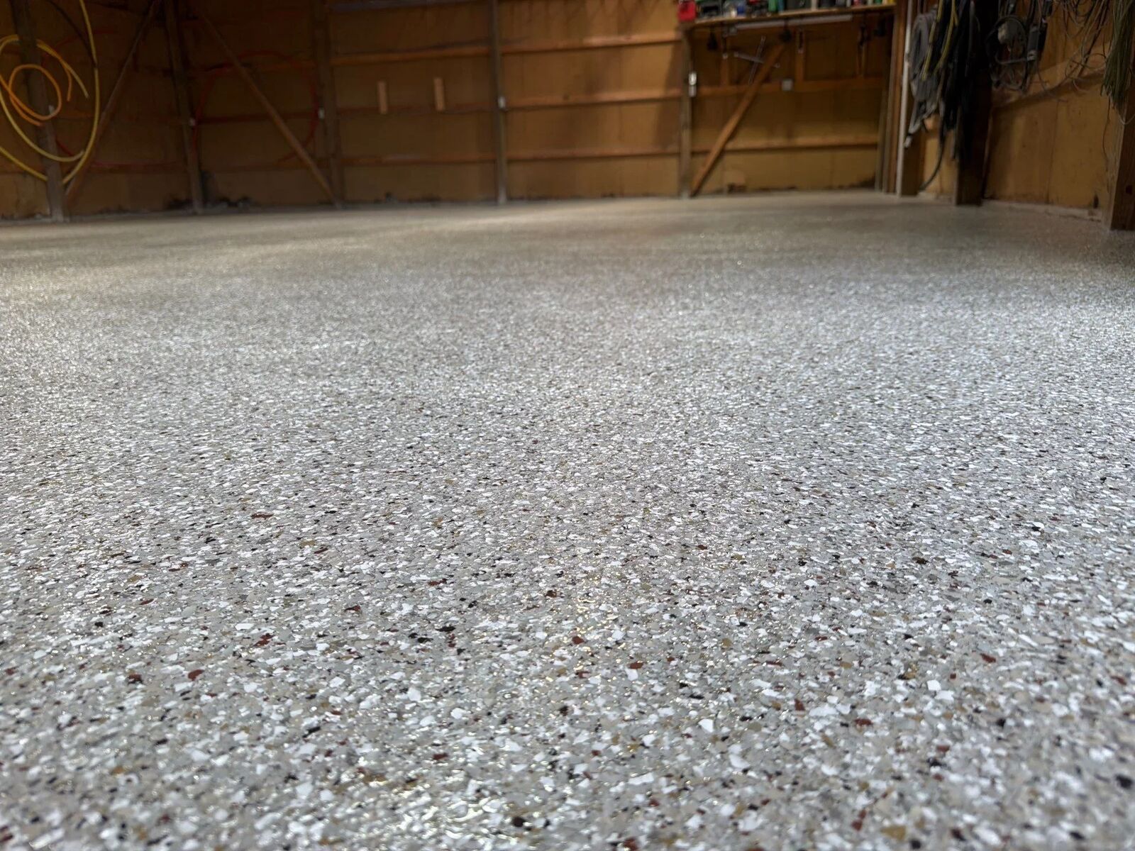 Finished flake floor with light reflecting on the top coat